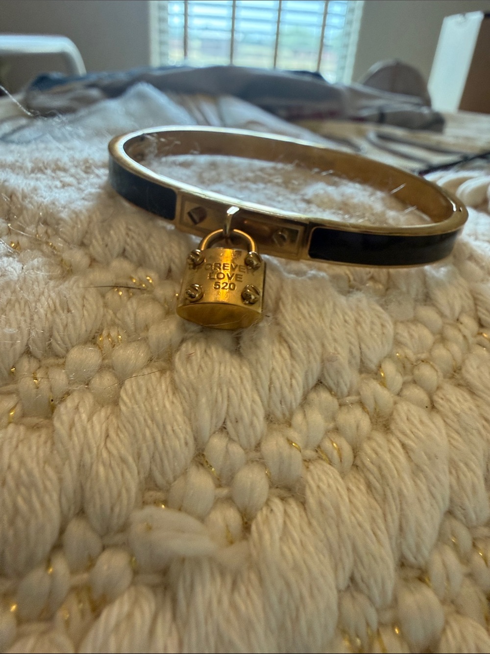 Gold-Tone Black Enamel Bangle with Padlock Charm